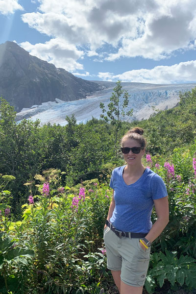Nicole with mountains behind her